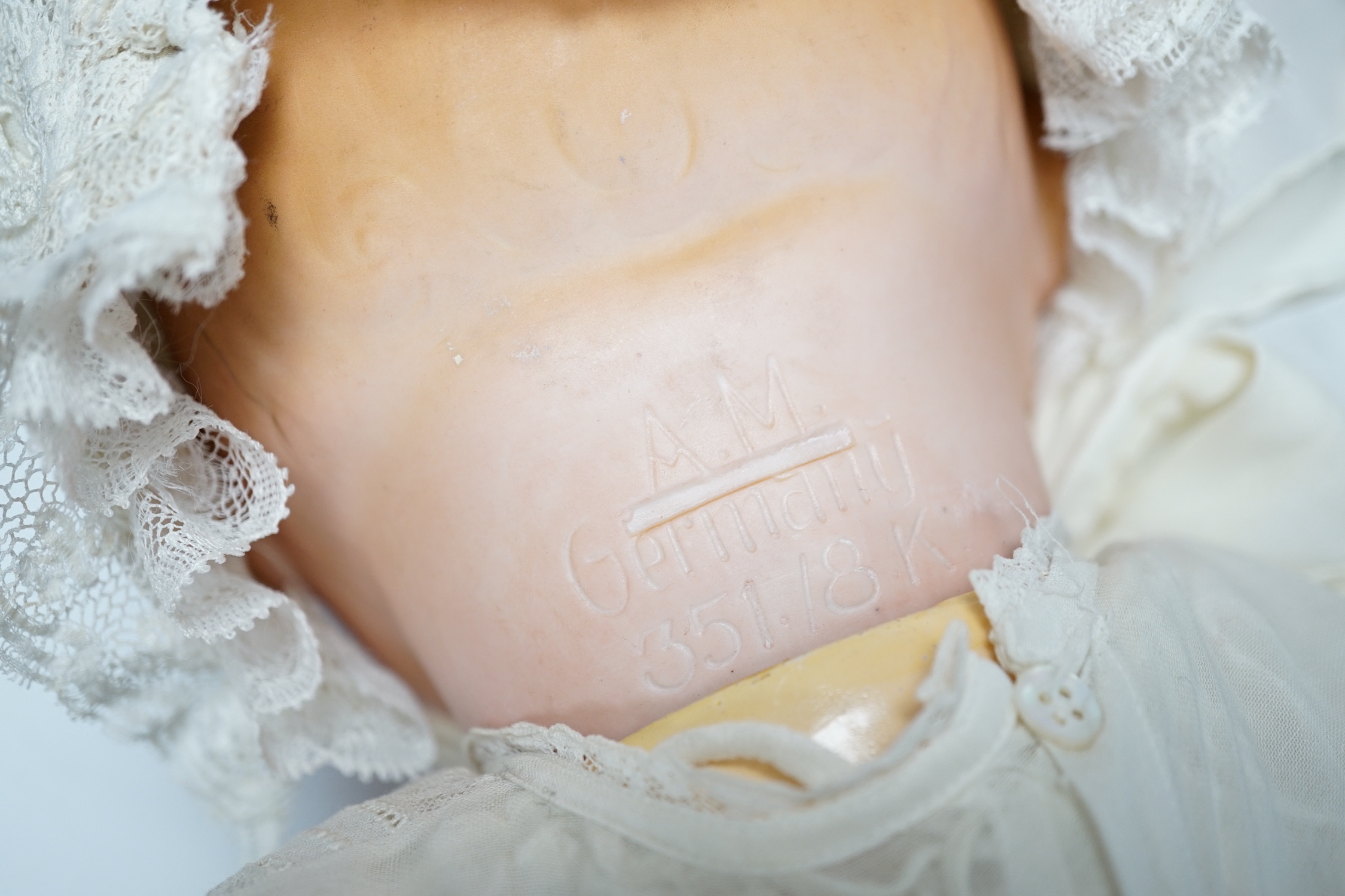 A Dream Baby AM351, 58cm, good condition and a Melitta Baby bisque head doll, 60cm, good condition